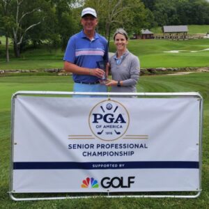 Gideon Smith and Ali Wells pose with a trophy after Smith won the 2024 Gateway PGA Senior PPC