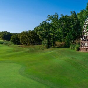 A golf hole at Osage National with a sign that reads 'Osage National Golf Course'